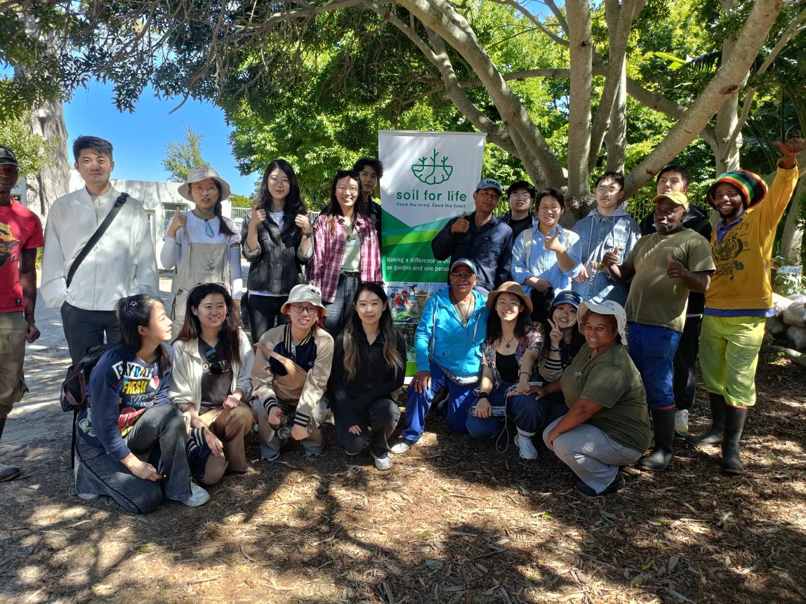 Group photo of SAF students at Soil for Life in Cape Town