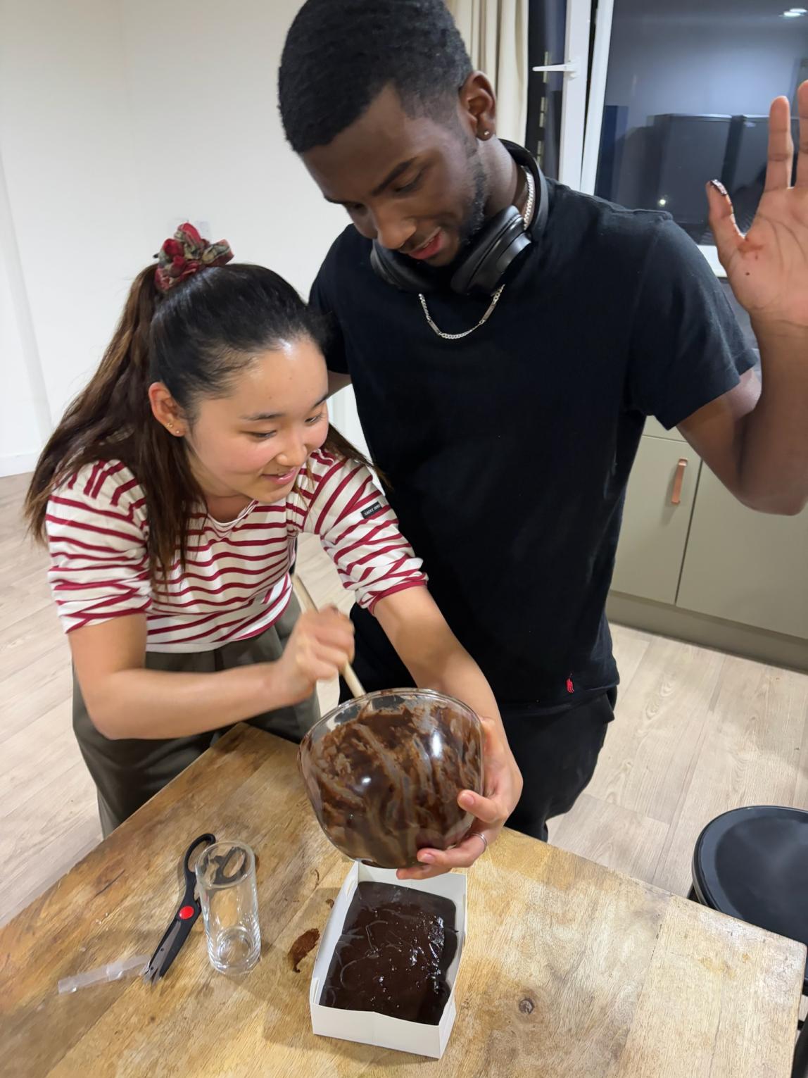 Yukyeong Jang cooking brownies with friend