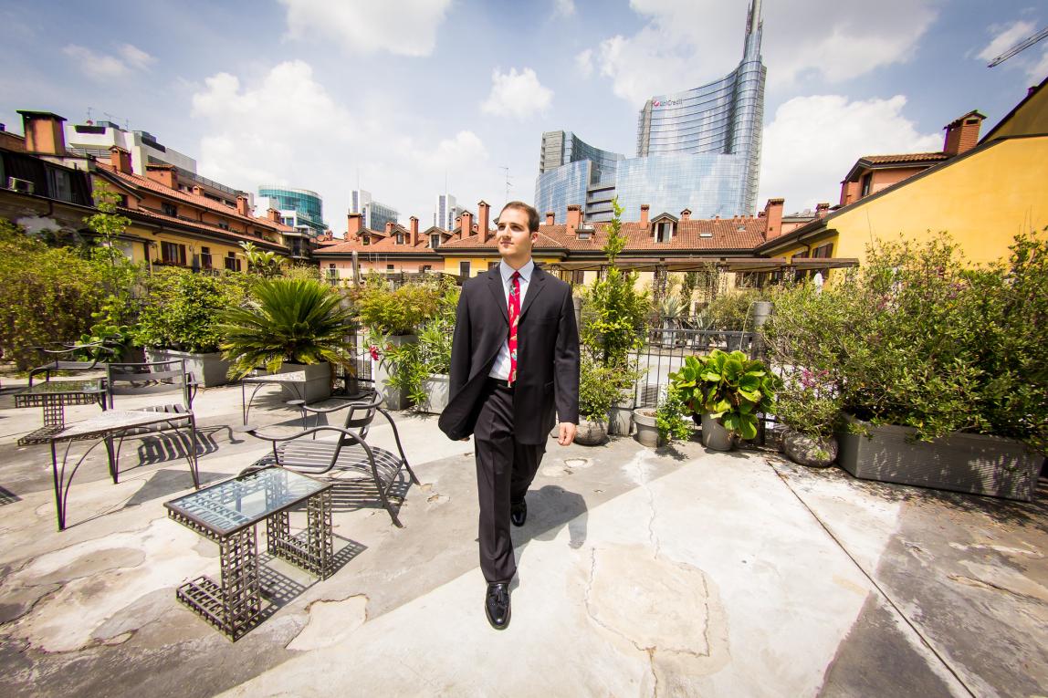 a business student walking in Milan