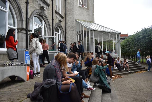dublin students sitting outside the architecture building at University College Dublin