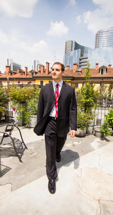 a business student walking in Milan