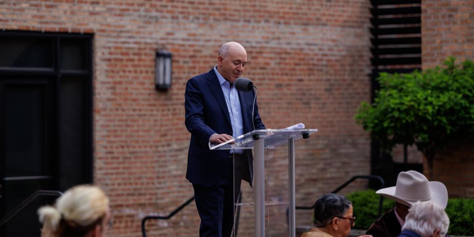 Greg at Podium for 75th Anniversary Celebration All Staff Event 2025